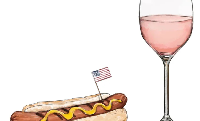 hot dog and glass of wine
